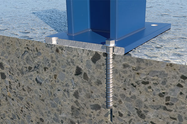 Vista de la instalación de una viga en hormigón fisurado con los tornillos directos a hormigón de INDEX