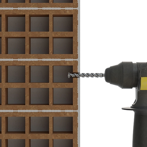 Paso 1 perforación del ladrillo hueco con taladro percutor